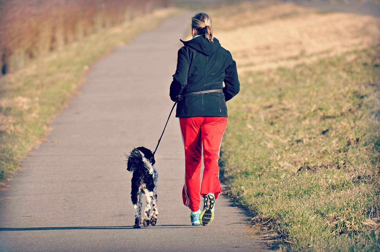 a woman who jogs with her dog